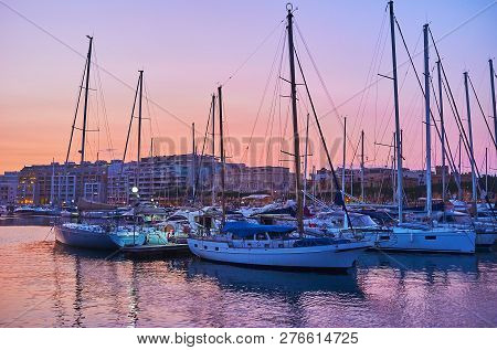 The Lines Of Moored Yachts In Marina Of Msida With A View On Bright Twilight Sky On Background, Malt