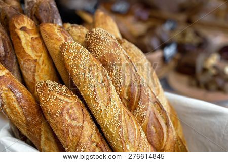 Traditional Crusty French Bread Baguette In Basket At Bakery. Fresh Organic Pastry At Local Market. 