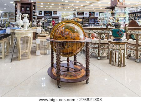 Maan, Jordan, December 07, 2018 : A Large Decorative Wooden Globe For Sale In A Roadside Store Near 