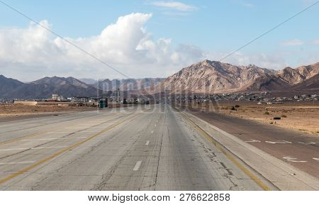 Maan, Jordan, December 07, 2018 : Intercity Route Passing Near The Foot Of The Red Mountains In The 