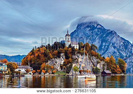 Beautiful Scenic Sunset Over Austrian Alps Lake. Boats, Yachts In The Sunlight Infront Of Church On 