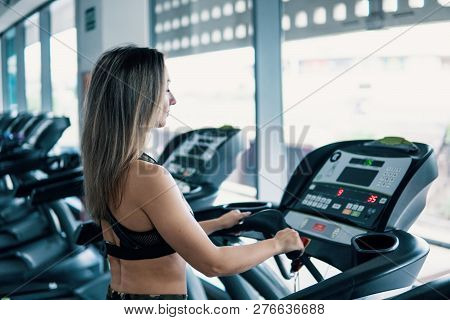 Young Fit Woman Doing Running Exercise In Gym