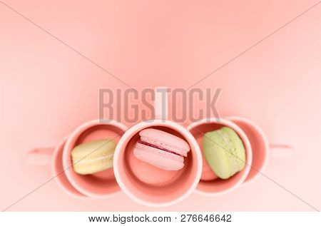 Sweet Macaroons In Coral-colored Cups. Coral Color Is The Color Of 2019.