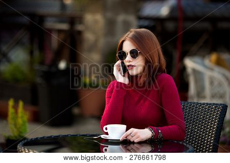 Lifestyle Fashion Portrait Of Young Stylish Hipster Woman Walking On The Street.