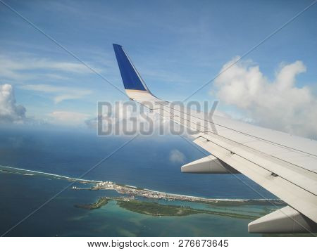 Left Wing Of An Airplane Over Guam