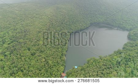Aerial View Of Lake Bulusan In The Mountains With Green Rain Forest. Lake Hidden In The Jungle Mount