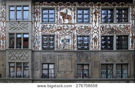 LUCERNE, SWITZERLAND - JUNE 24, 2018: Painted house facade commemorating Battle of Dornach on Hirschenplatz in Old Town of Lucerne, Switzerland
