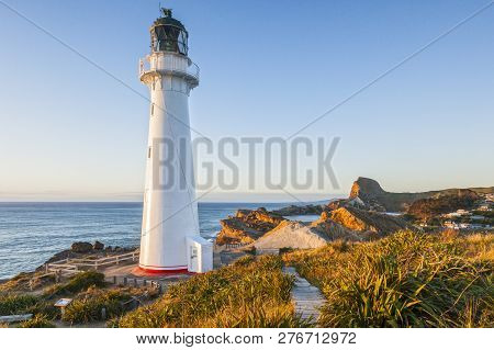 Castlepoint Lighthouse, Wairarapa, New Zealand At Sunrise