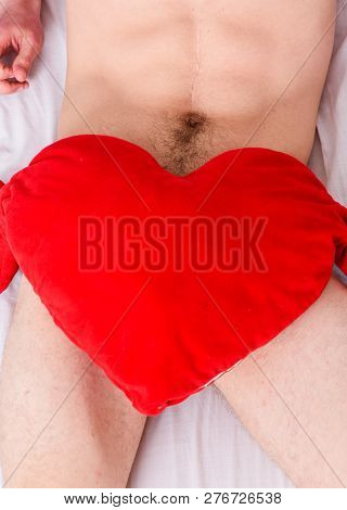 Male Genitals Covered With Big Red Plush Heart Toy. Love And Sex Concept. Valentines Day Surprise. S