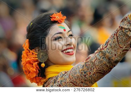 Kolkata , India - March 1, 2018: Beautiful Young Girl With Spring Festive Make Up With Flowers , Joy