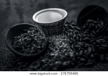 Close Up Of Paste Of Custard Apple Seeds In A Glass Bowl With Some Powdered Seeds And Raw Dried Seed