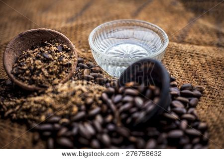 Home Remedy To Cure Lice Or Joon On Brown Colored Surface I.e. Custard Apple Seeds Dried And Powdere
