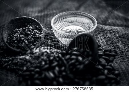 Home Remedy To Cure Lice Or Joon On Brown Colored Surface I.e. Custard Apple Seeds Dried And Powdere