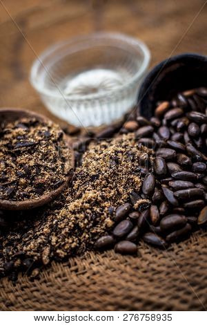Home Remedy To Cure Lice Or Joon On Brown Colored Surface I.e. Custard Apple Seeds Dried And Powdere