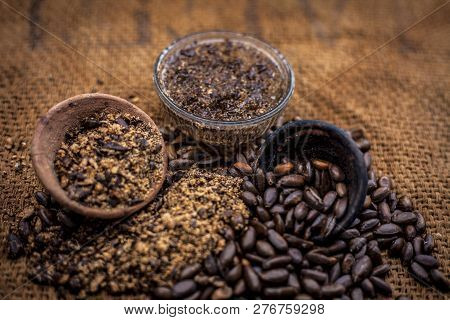 Home Remedy To Cure Lice Or Joon On Brown Colored Surface I.e. Custard Apple Seeds Dried And Powdere