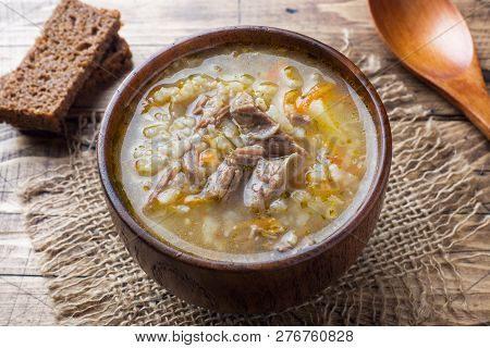 Kharcho Soup With Meat And Rice On Wooden Table