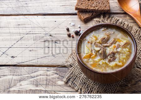 Kharcho Soup With Meat And Rice On Wooden Table
