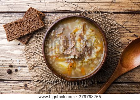 Kharcho Soup With Meat And Rice On Wooden Table