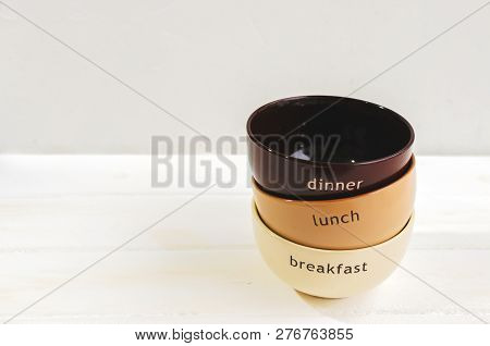Set Of Bowls. Written Breakfas, Lunch, Dinner On Ceramic Bowls.