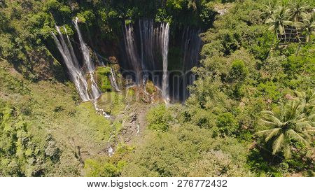 Beautiful Waterfall Coban Sewu In Tropical Forest, Java Indonesia. Aerial View Tumpak Sewu Waterfall
