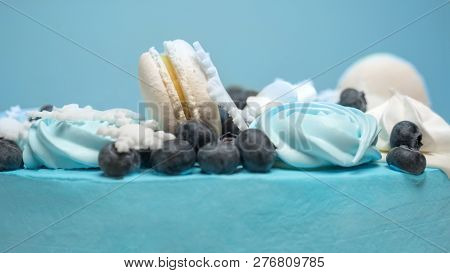 Pie Covered With Blue Mastic With Marshmallows, Zephir And Berries On The Top. Cake Decoration For W
