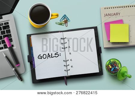 New Year Goals, Resolution Or Action Plan Concept. Notebook On Table With Laptop, Calendar, Coffee, 