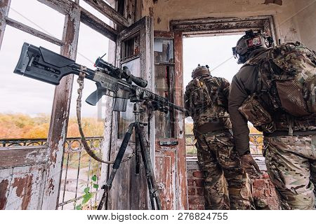 Kyiv, Ukraine - October 14, 2017: Two Snipers Look Out The Old Window During Airsoft Military Simula
