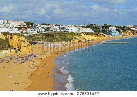 Albufeira, Algarve, Portugal - October 26, 2015 : Tourists Enjoying The Sun On Albufeira Beach In Po
