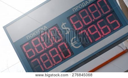 Electronic Currency Board Outside In The Streets Of Russia. Dollars Euro Exchange Electronic Screen 