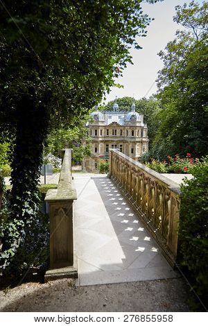 Le Port-marly, France - June 24, 2018: Stone Bridge And The Chateau De Monte-cristo (architect Hippo