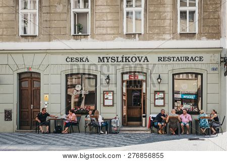 Prague, Czech Republic - August 23, 2018: People Drinking Beer At The Outdoor Tables Of 