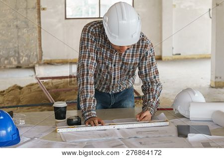 Architect And Engeneer On Construciton Site Check Documents And Business Workflow On Building