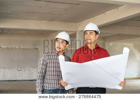 Team Of Business People In Group, Architect And Engeneer On Construciton Site Check Documents And Bu