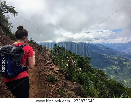 Salkantay, Trail,  Peru - May 7th, 2016: A Young Female Hiker Starts On Her Hike Through The Valleys