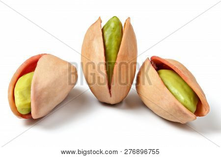 Three Turkish Red Pistachios (antep Fistigi) Peeled Green Nuts Visible Under Shell, Isolated On Whit
