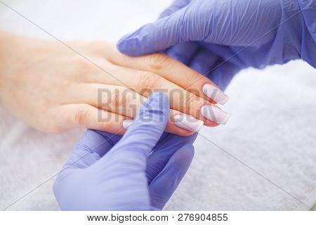 Spa Manicure. French Manicure At Spa Salon. Woman Hands In A Nail Salon Receiving A Manicure Procedu