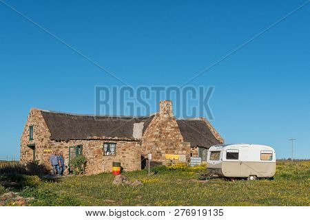 Nieuwoudtsville, South Africa, August 28, 2018: A Chalet, Toilet Facilities And A Caravan At Matjies