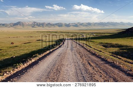 Unpaved Road And Yurts Near Son-kul Lake And Tien Shan Mountains In Kyrgyzstan