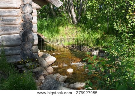 Solovki, Republic Of Karelia, Russia - June 25, 2018:a Small Wooden House Stands On The Shore Of A F