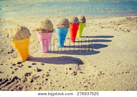 Colorful Sand Cones In The Sand On The Beach,summer Concept,used Split Toning For Vintage Style.