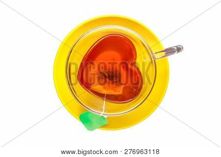 Hot Black Tea Heart Shaped Cup And Yello Saucer, Top View Isolated On White