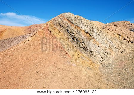Colored sands in the Makhtesh Gadol erosion crater in the desert in Israel