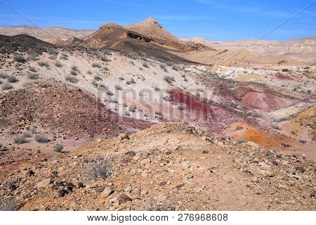 Colored sands in the Makhtesh Gadol erosion crater in the desert in Israel