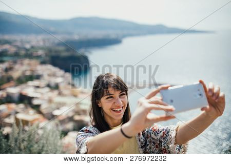 Happy Woman Traveler Smiling At Italian Coast View.woman Traveling To European South Coast.enoying S