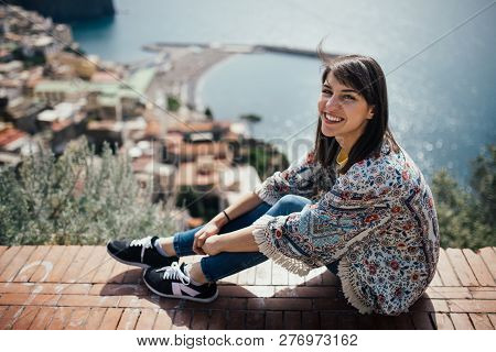 Happy Woman Traveler Smiling At Italian Coast View.woman Traveling To European South Coast.enoying S