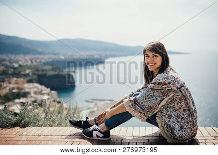 Happy Woman Traveler Smiling At Italian Coast View.woman Traveling To European South Coast.enoying S