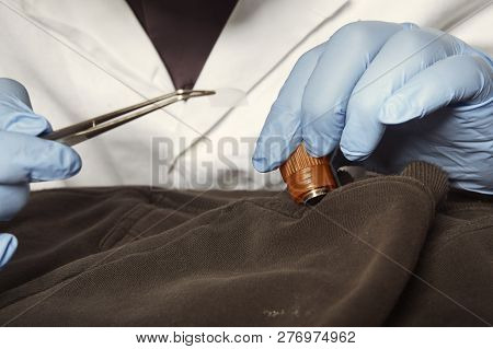 Proccess Of Collecting Possible Gunshot Residue From Suspected Clothes In Police Lab