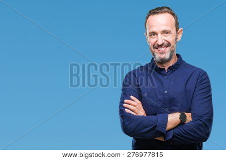 Middle age hoary senior man over isolated background happy face smiling with crossed arms looking at the camera. Positive person.
