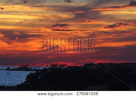 Dramatic, Coloful Sunset Over Albemarle Sound As Viewed From Jockeys Ridge State Park In The Town Of