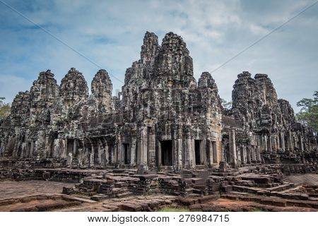 angkor thom, cambodia - november 28, 2018: bayon temple with 54 towers, each displaying 4 smiling faces of the bodhisattva avalokiteshvara.